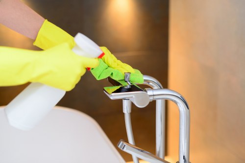 Local cleaning team working in a W14 apartment during end of tenancy cleaning