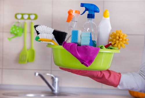 A professional cleaner preparing a guest-ready Airbnb flat in W14
