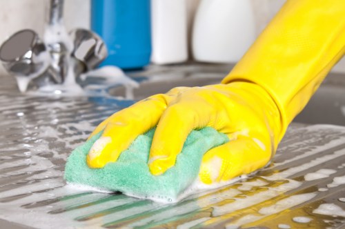 Cleaning staff maintaining a shared workspace in West London