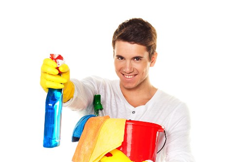 Cleaner treating a carpet stain in a W14 flat